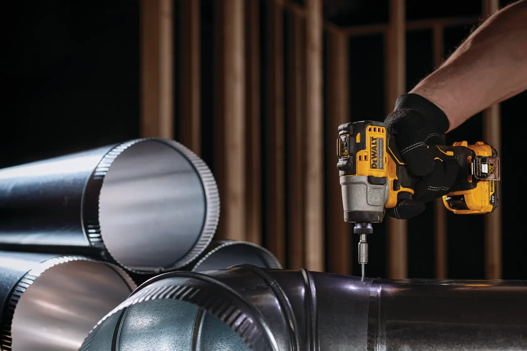 DEWALT brushless tool for photography, shows DCK2111L2T-XE, DCF801N. Yellow and black compact power tool.