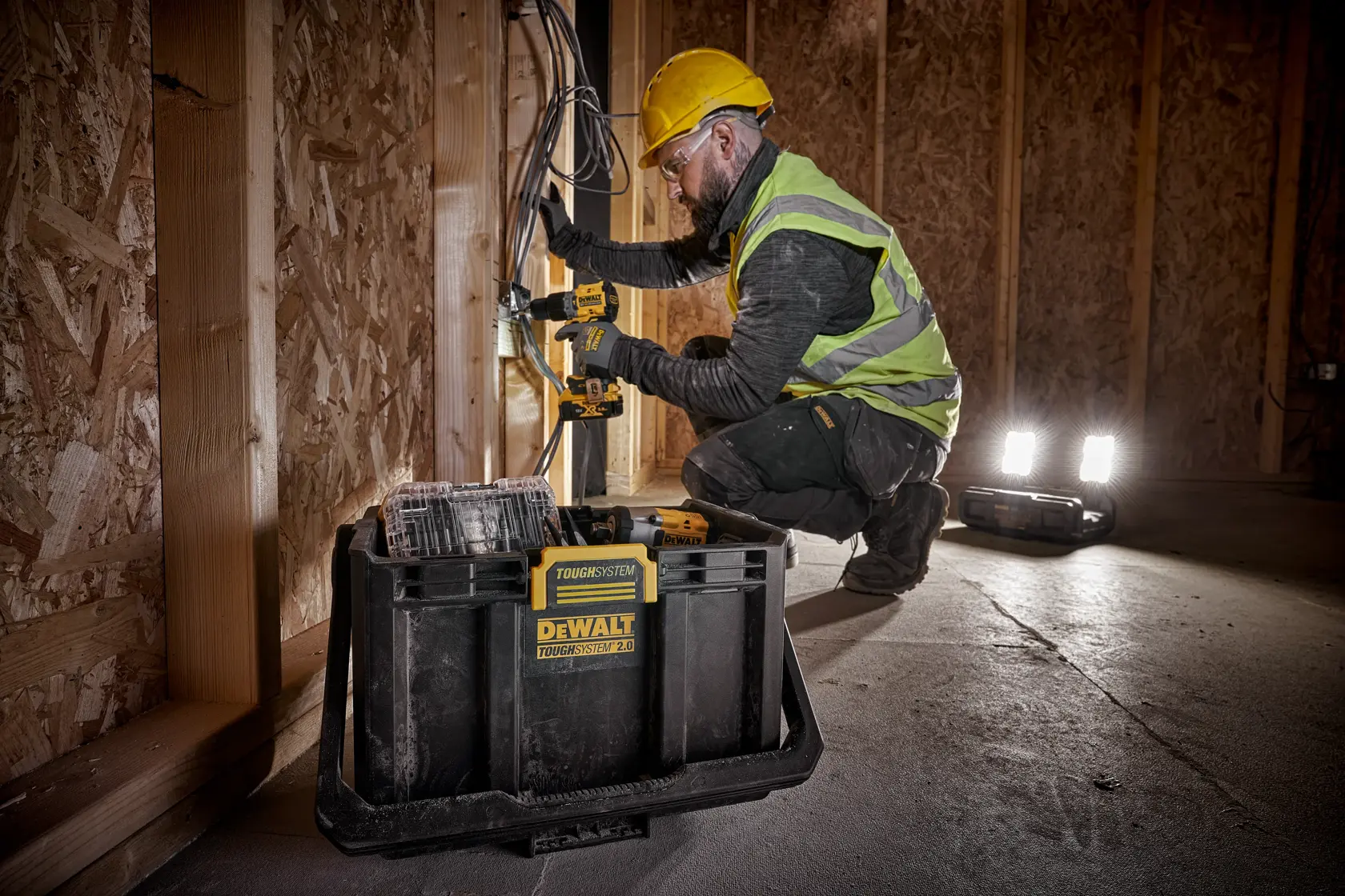 DEWALT ToughSystem 2.0 promotional graphic with the slogan 'Storage Built to Handle It' in large, bold yellow lettering on a dark, textured background.