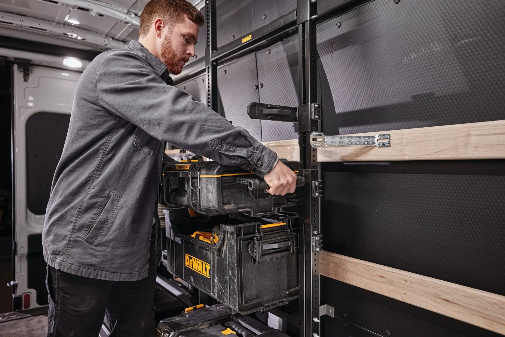 DEWALT ToughSystem 2.0 promotional graphic with the slogan 'Storage Built to Handle It' in large, bold yellow lettering on a dark, textured background.