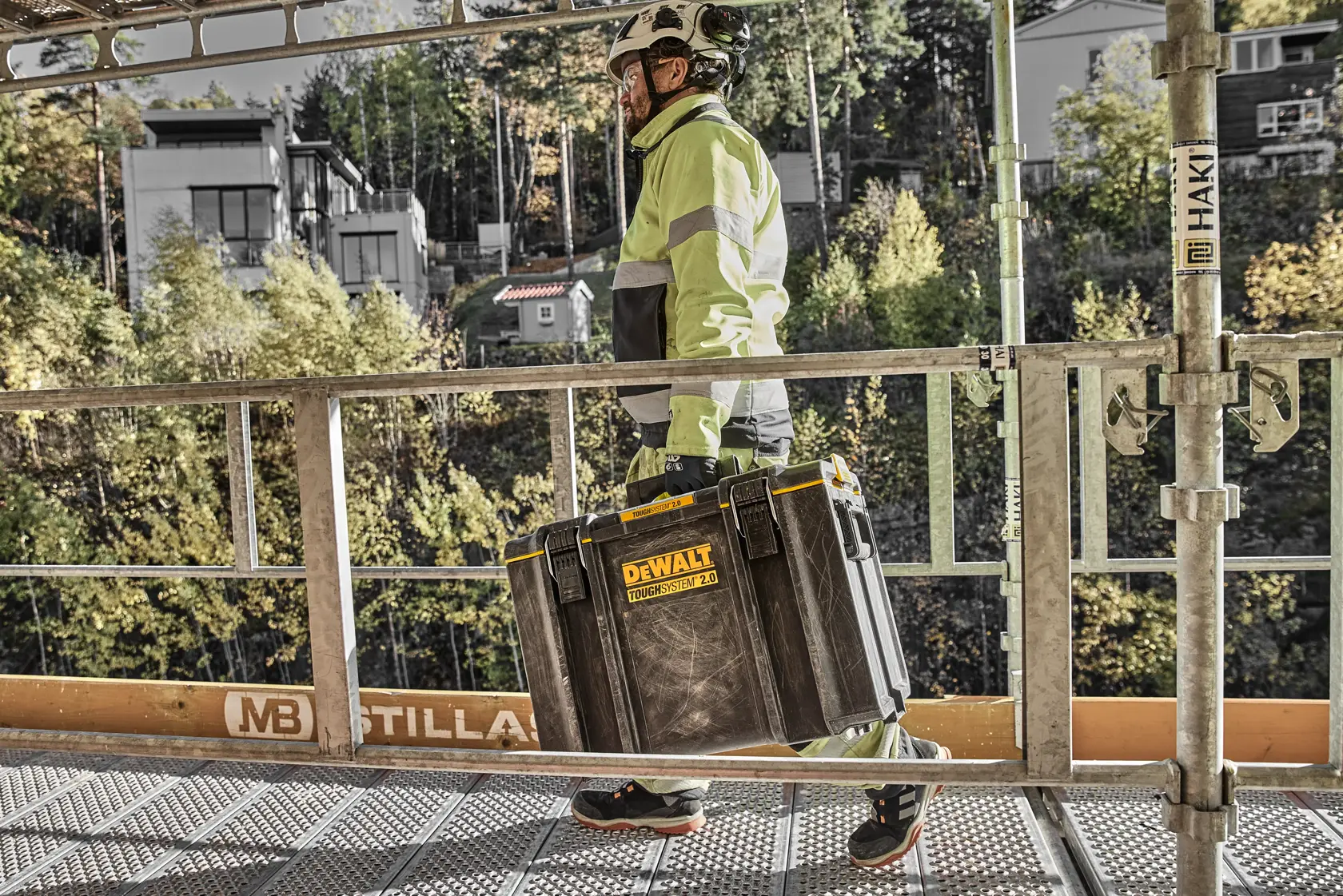 DEWALT ToughSystem 2.0 promotional graphic with the slogan 'Storage Built to Handle It' in large, bold yellow lettering on a dark, textured background.