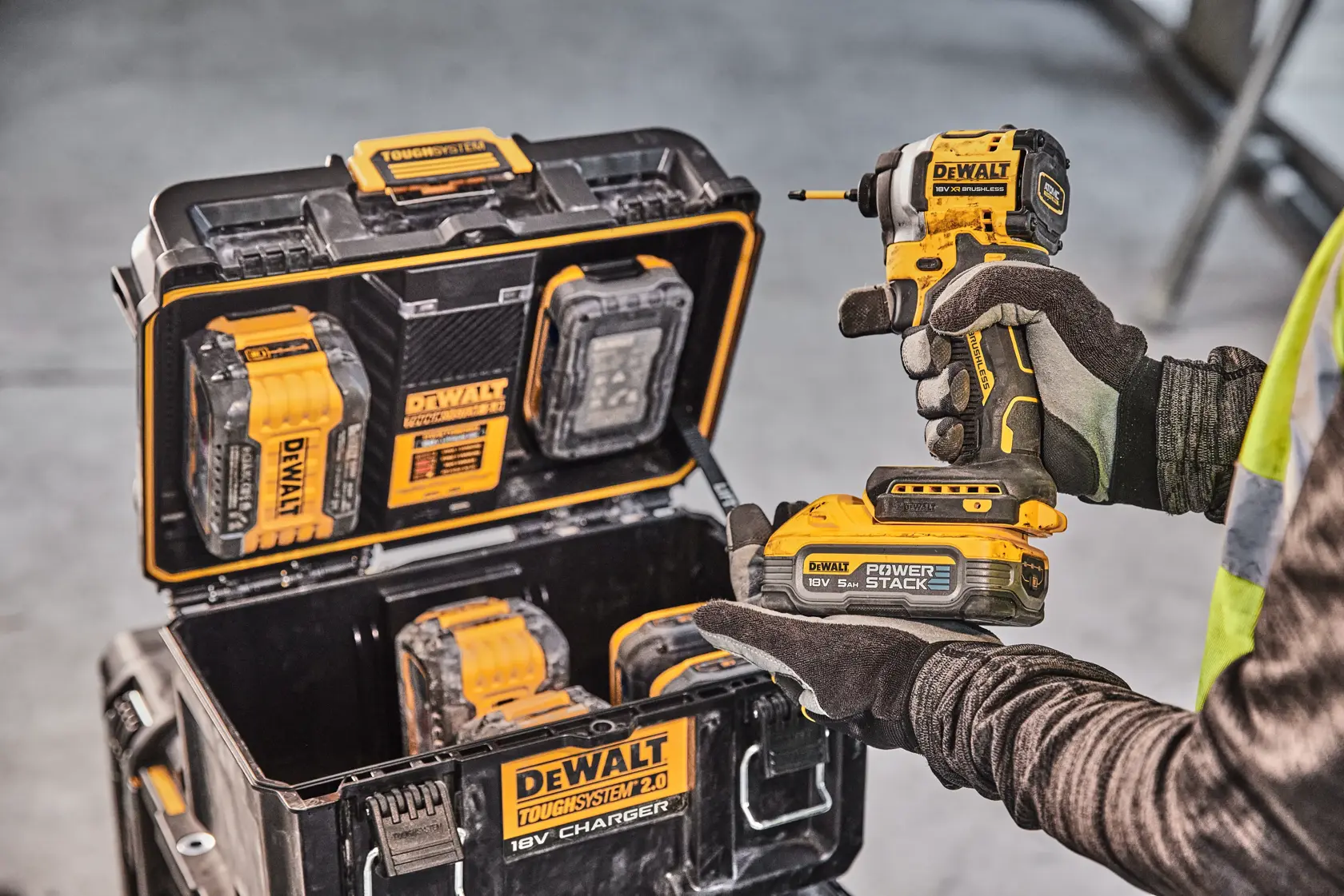 DEWALT ToughSystem 2.0 promotional graphic with the slogan 'Storage Built to Handle It' in large, bold yellow lettering on a dark, textured background.