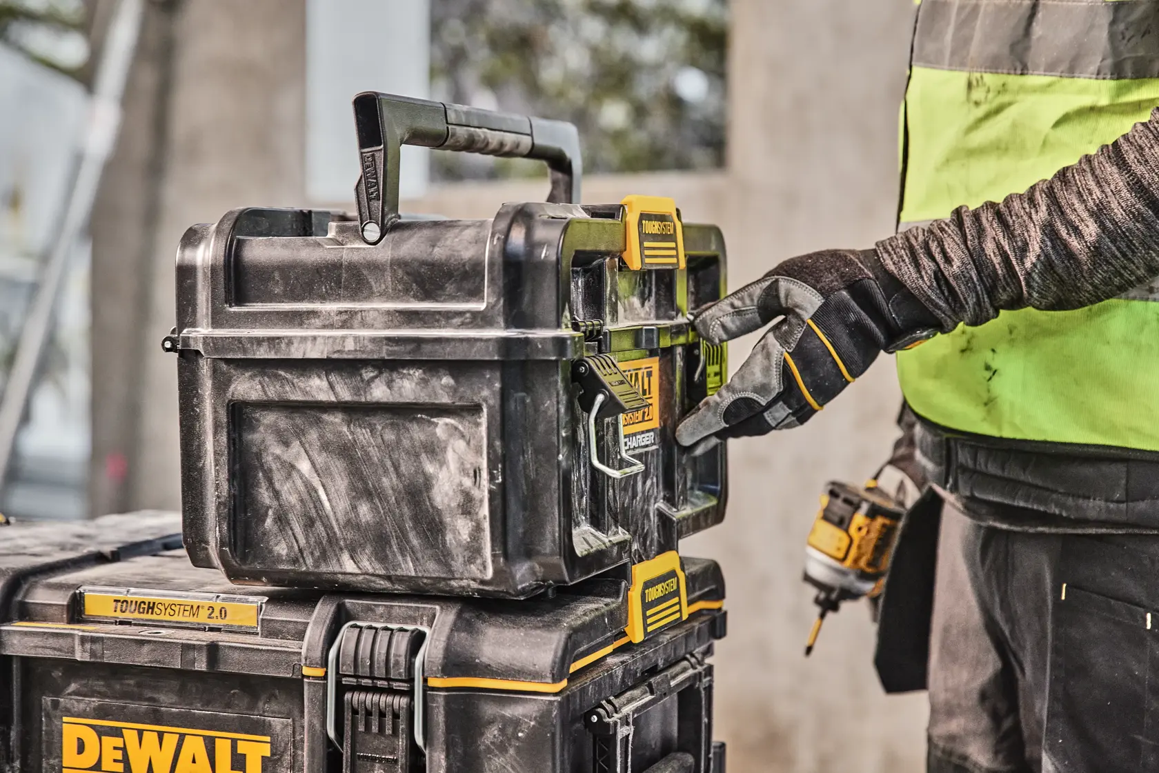 DEWALT ToughSystem 2.0 promotional graphic with the slogan 'Storage Built to Handle It' in large, bold yellow lettering on a dark, textured background.